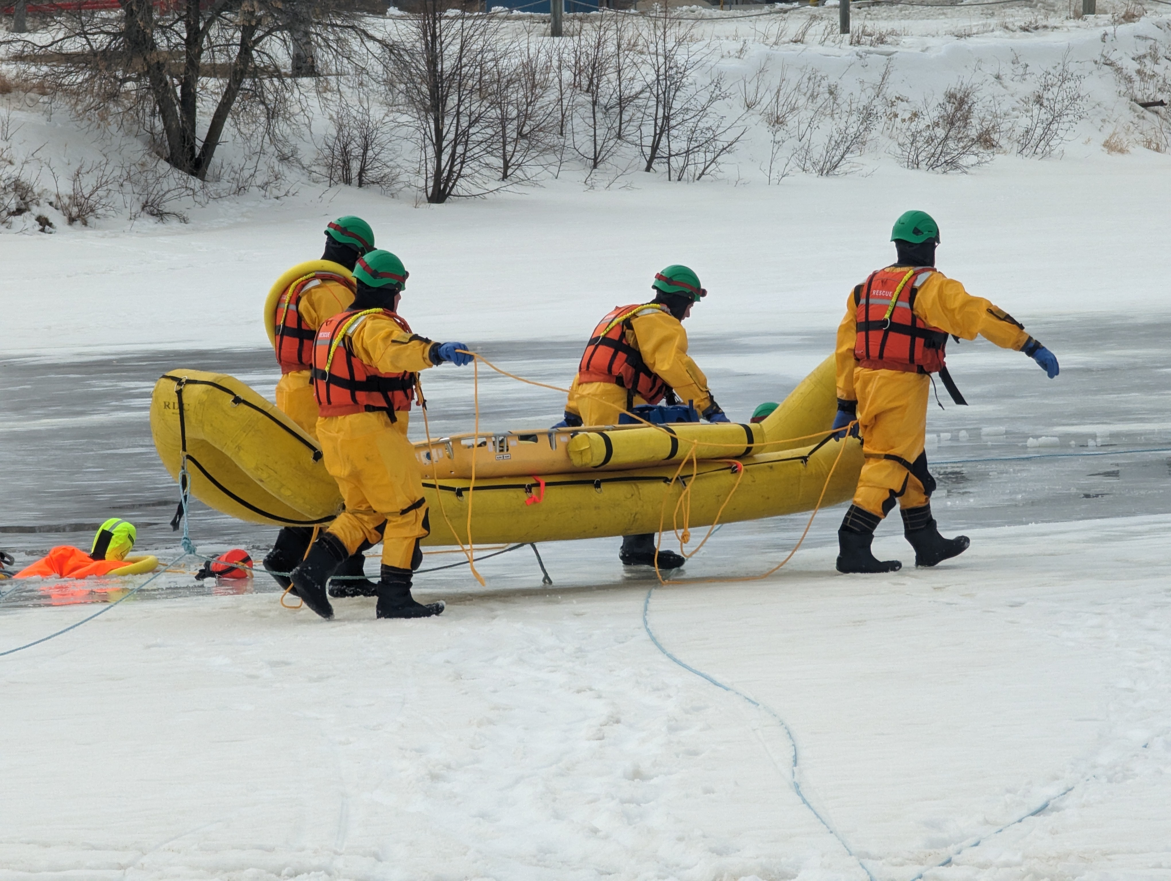 Firefighters deploying the Rapid Deployment Craft for Ice Water Training