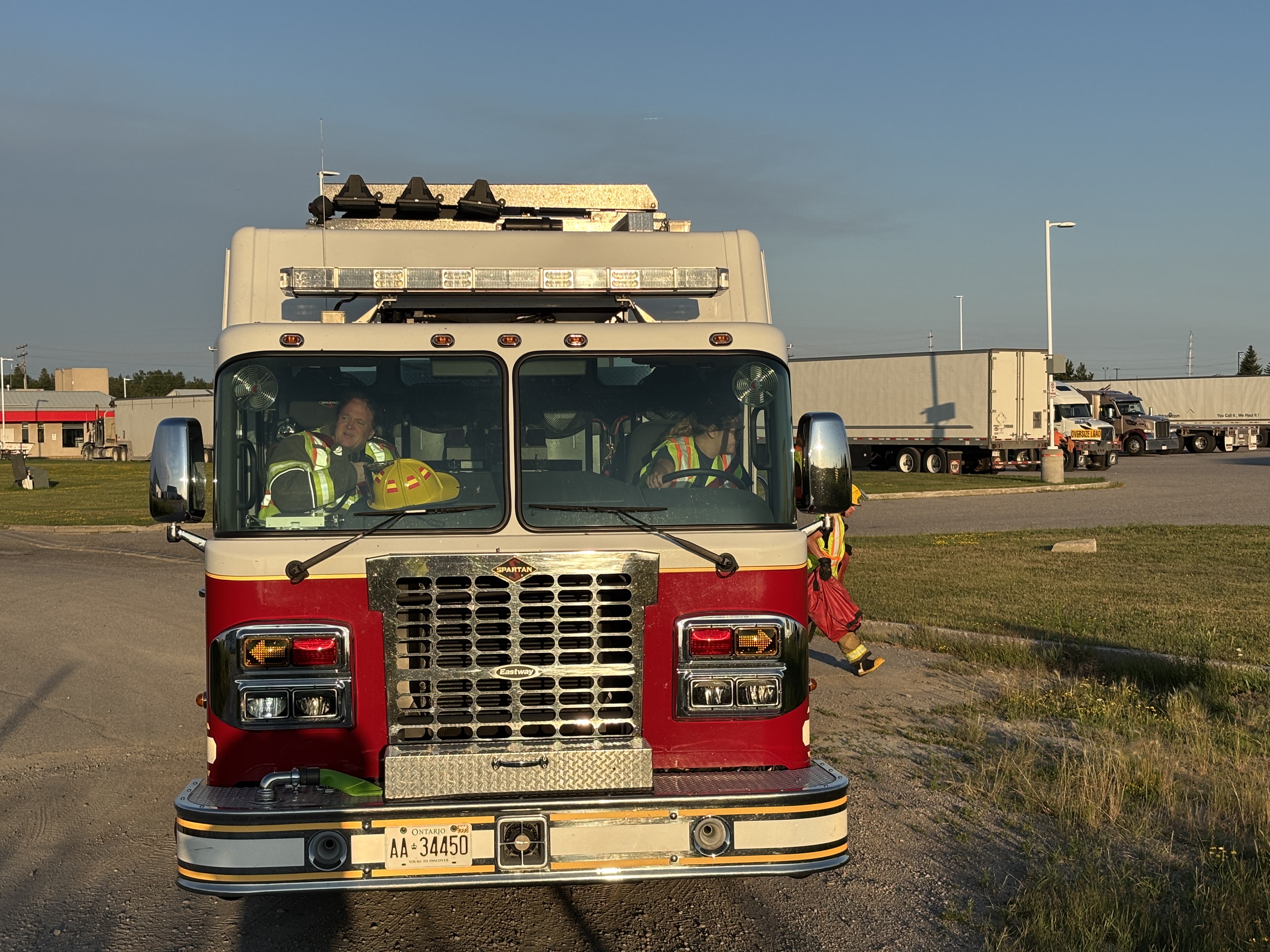 Firefighters Driving a Fire Apparatus