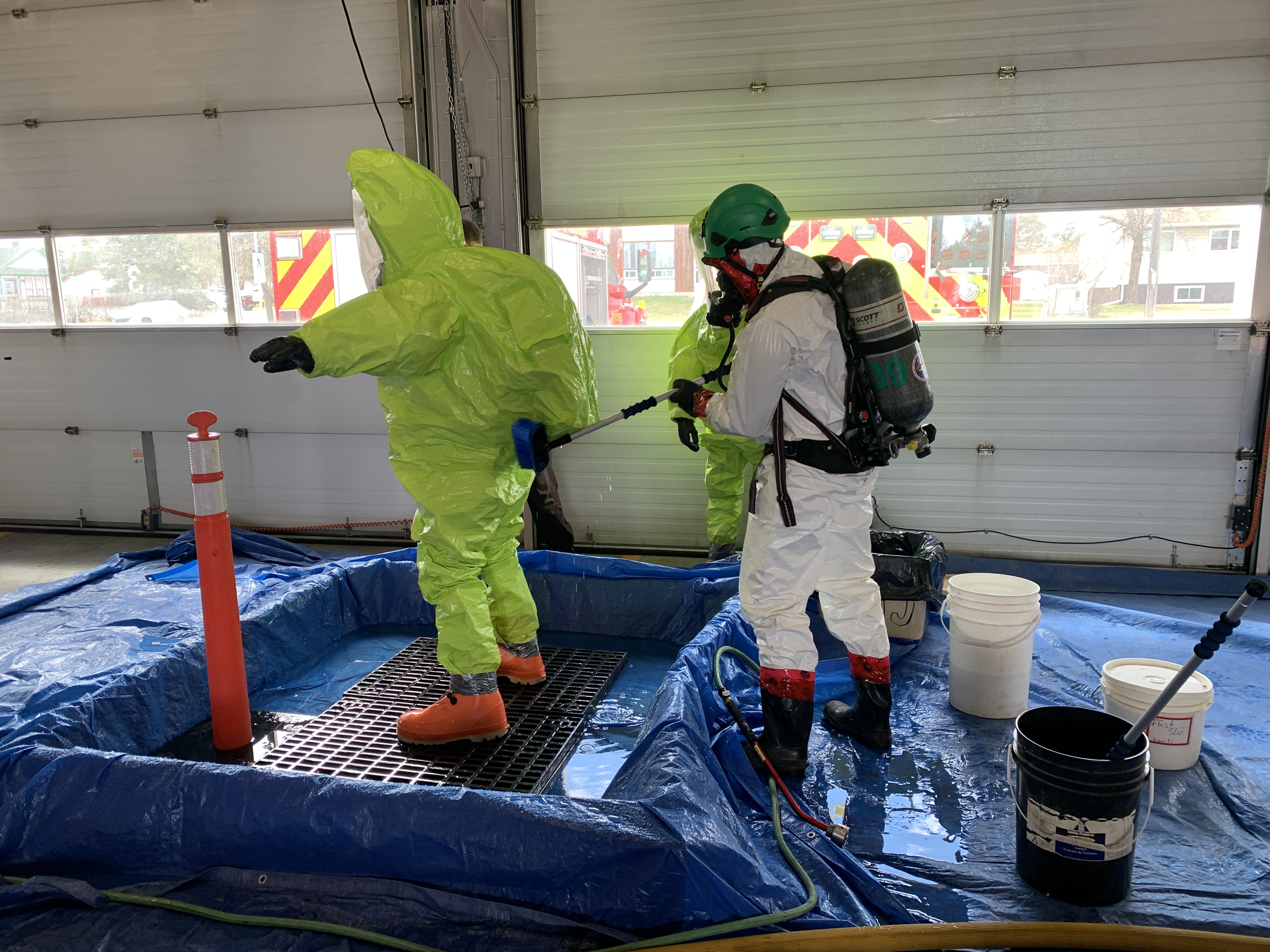 Firefighters performing decontamination of hazardous materials