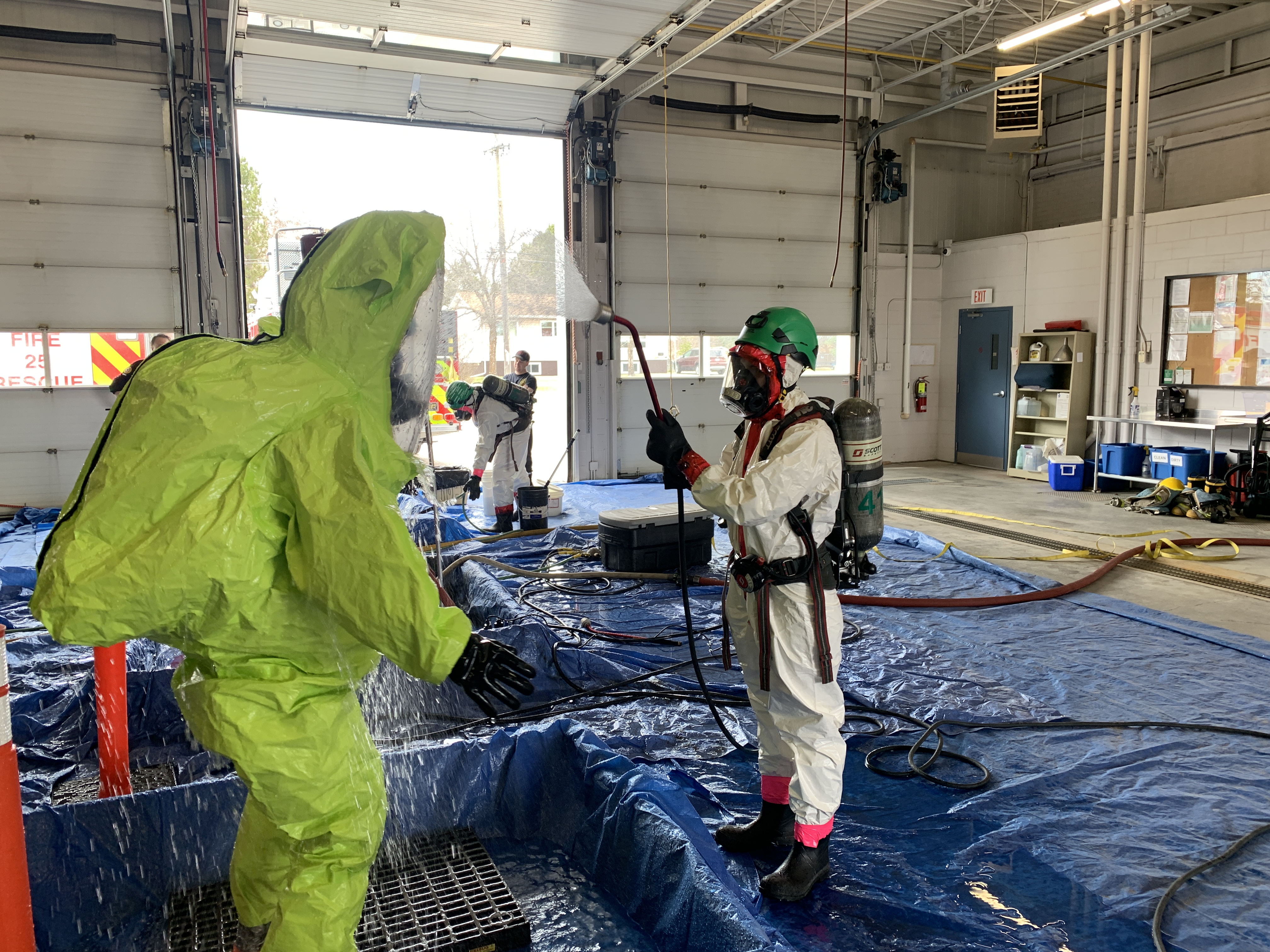 Firefighters performing technical decontamination during hazardous materials course